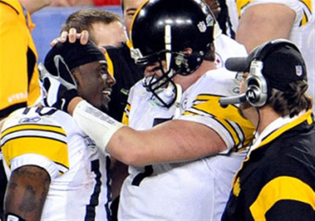Steelers quarterback Ben Roethlisberger and wide receiver Santonio Holmes share a moment after their legendary play in Super Bowl XLIII