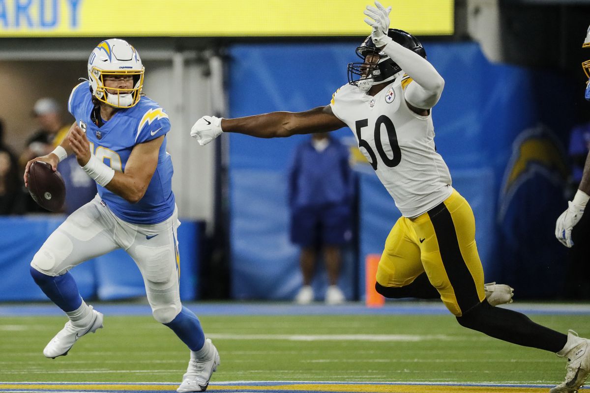 Steelers linebacker, Delontae Scott, chases down Los Angeles Chargers quarterback Justin Herbert