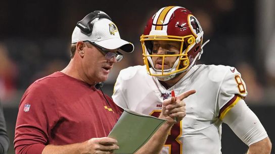 Jay Gruden coaches quarterback Dwayne Haskins during his time in Washington as head coach Jay Gruden coaches quarterback Dwayne Haskins during his time in Washington as head coach