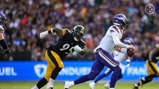 Steelers' defensive lineman Keeanu Benton chases down Minnesota Vikings quarterback, Carson Wentz.