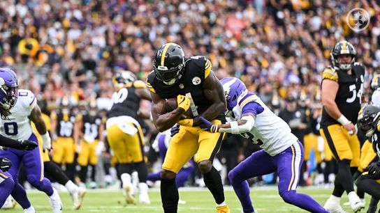 Steelers' wide receiver DK Metcalf runs with the football