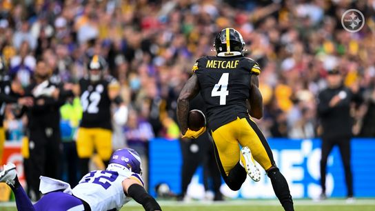 DK Metcalf running with the football against the Minnesota Vikings in Dublin, Ireland during the Steelers' 24-21 win.