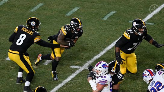Steelers quarterback Aaron Rodgers hands the ball to running back Jaylen Warren during Pittsburgh's 26-7 loss to the Buffalo Bills in Week 13 of the 2025 NFL Regular Season.