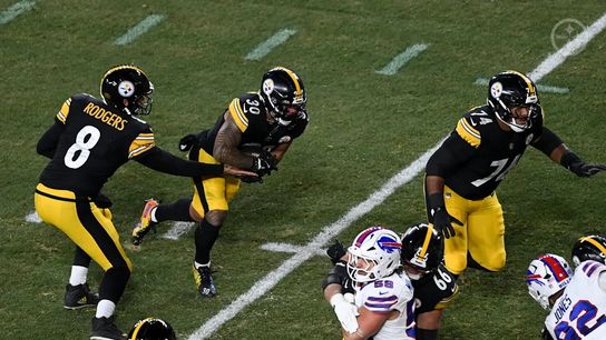 Steelers quarterback Aaron Rodgers (8) and Steelers running back Jaylen Warren (30) during a regular season matchup between the Pittsburgh Steelers and Buffalo Bills.