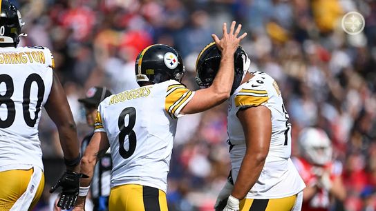 Aaron Rodgers (8) and Troy Fautanu during a regular season game against the New England Patriots Steelers' Aaron Rodgers Troy Fautanu