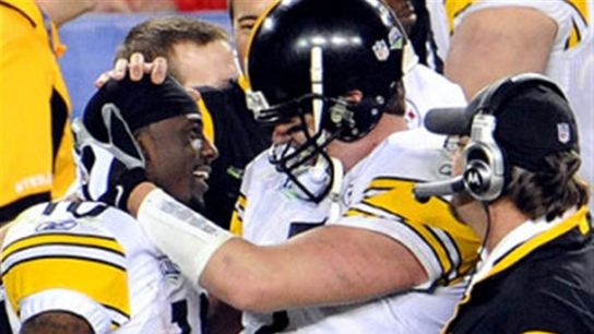 Steelers quarterback Ben Roethlisberger and wide receiver Santonio Holmes share a moment after their legendary play in Super Bowl XLIII