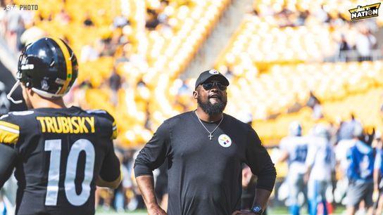Steelers head coach, Mike Tomlin stands and stares into the distance on the field at Acrisure Stadium prior to a 2022 preseason game. | 
