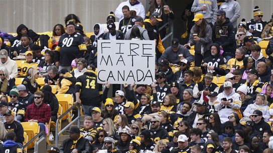 Steelers fan holding a sign that says Steelers fan holding a sign that says