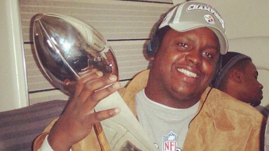 Trai Essex celebrates one of his 2 Super Bowl victories while holding the Lombardi Trophy Steelers Trai Essex
