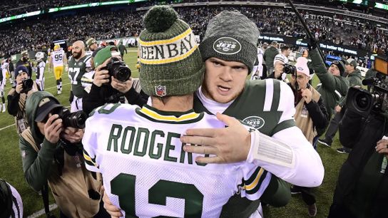Aaron Rodgers and Sam Darnold embrace after a 2018 matchup.