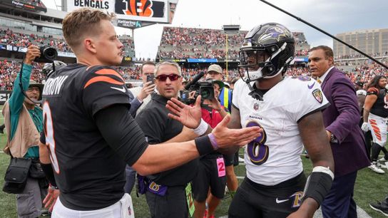 Bengals' Joe Burrow (9) and Ravens' Lamar Jackson (8) after a game in Cincinnati, OH.