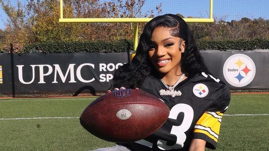 Steelers' fan and famous artist GloRilla wearing pads and a custom Steelers jersey. Steelers' GloRilla