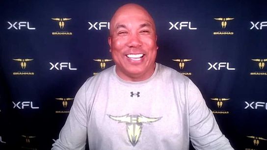 Hines Ward smiles his famous smile in front of an XFL backdrop Hines Ward smiles his famous smile in front of an XFL backdrop