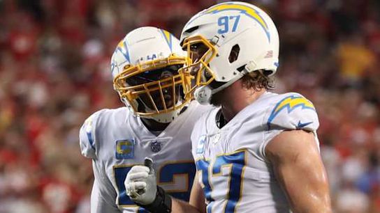 Joey Bosa and Khalil Mack celebrating together during a Los Angeles Chargers game.