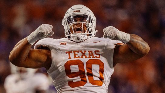 Former Texas defensive lineman Byron Murphy II flexes after a big stop. Steelers' Byron Murphy II