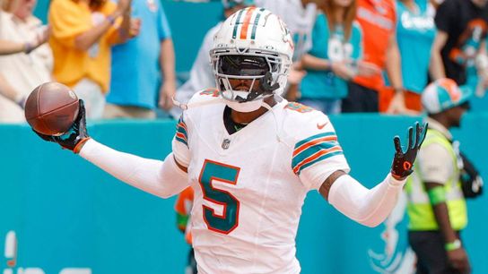 Dolphins' CB Jalen Ramsey celebrating a game-winning INT at Hard Rock Stadium.