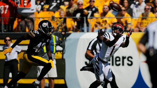 Cincinnati Bengals WR Ja'Marr Chase attempting to make a catch against the Steelers defense. Cincinnati Bengals WR Ja'Marr Chase attempting to make a catch against the Steelers defense.