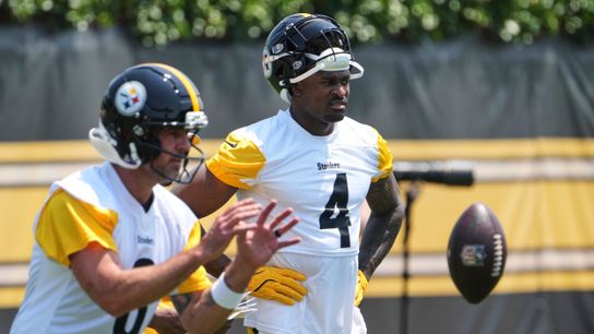 Steelers' Aaron Rodgers and DK Metcalf lined up and starting a play during mandatory mini camp.